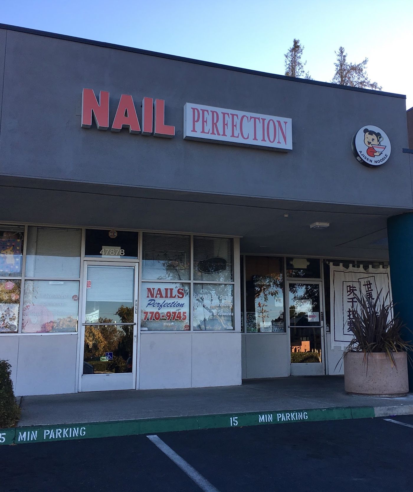 Nails Perfection storefront at 47878 Warm Springs Blvd, Fremont — coral NAIL PERFECTION sign above the door.
